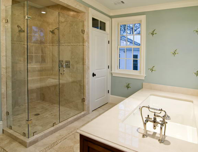 White-colored washbasin and the glass shower room