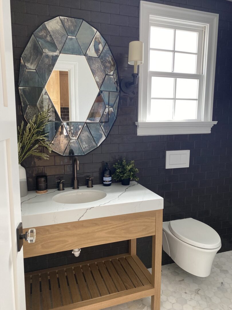 solid wood bathroom vanity and the oval-shaped mirror