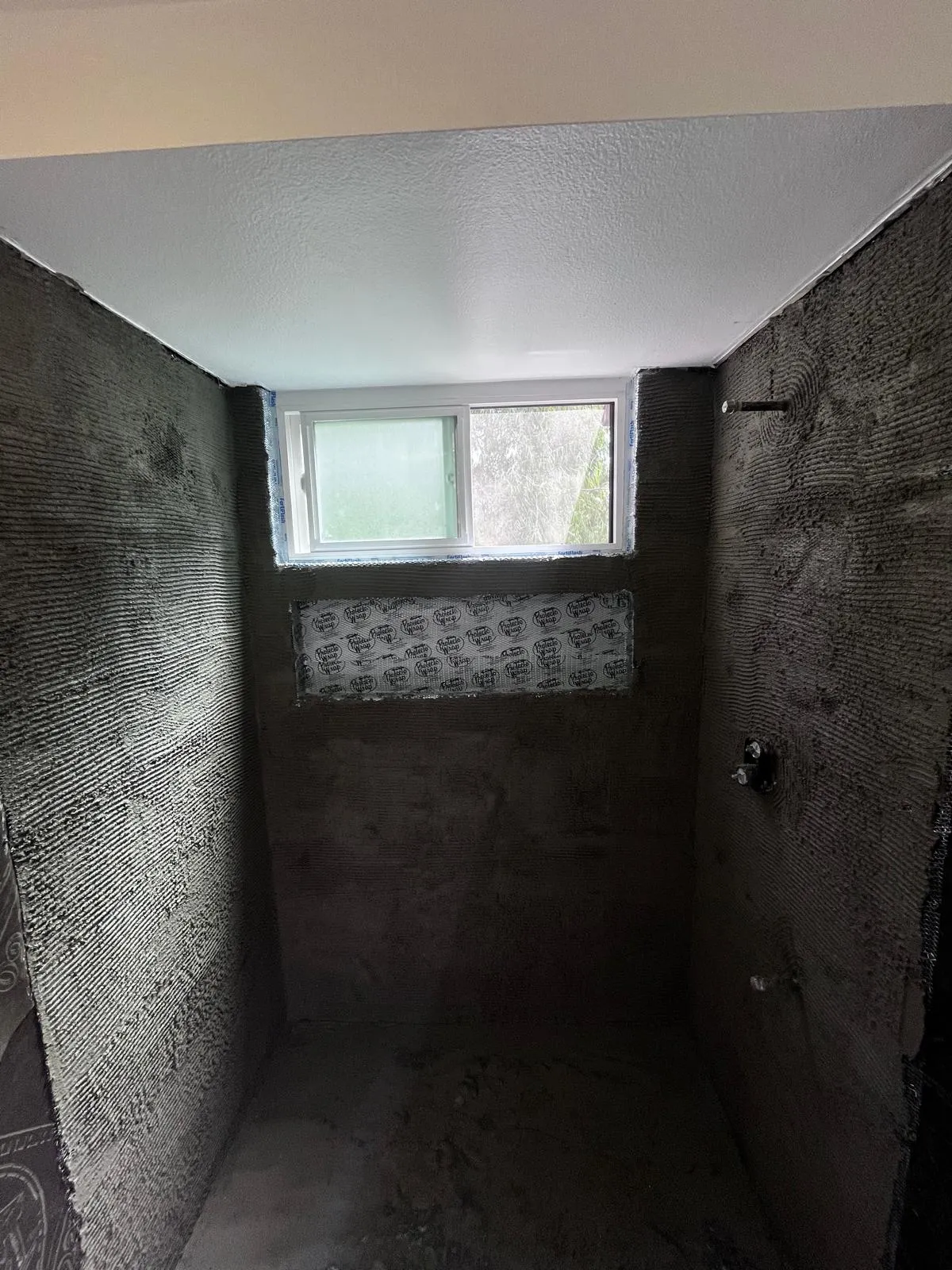 Bare walls in a small bathroom