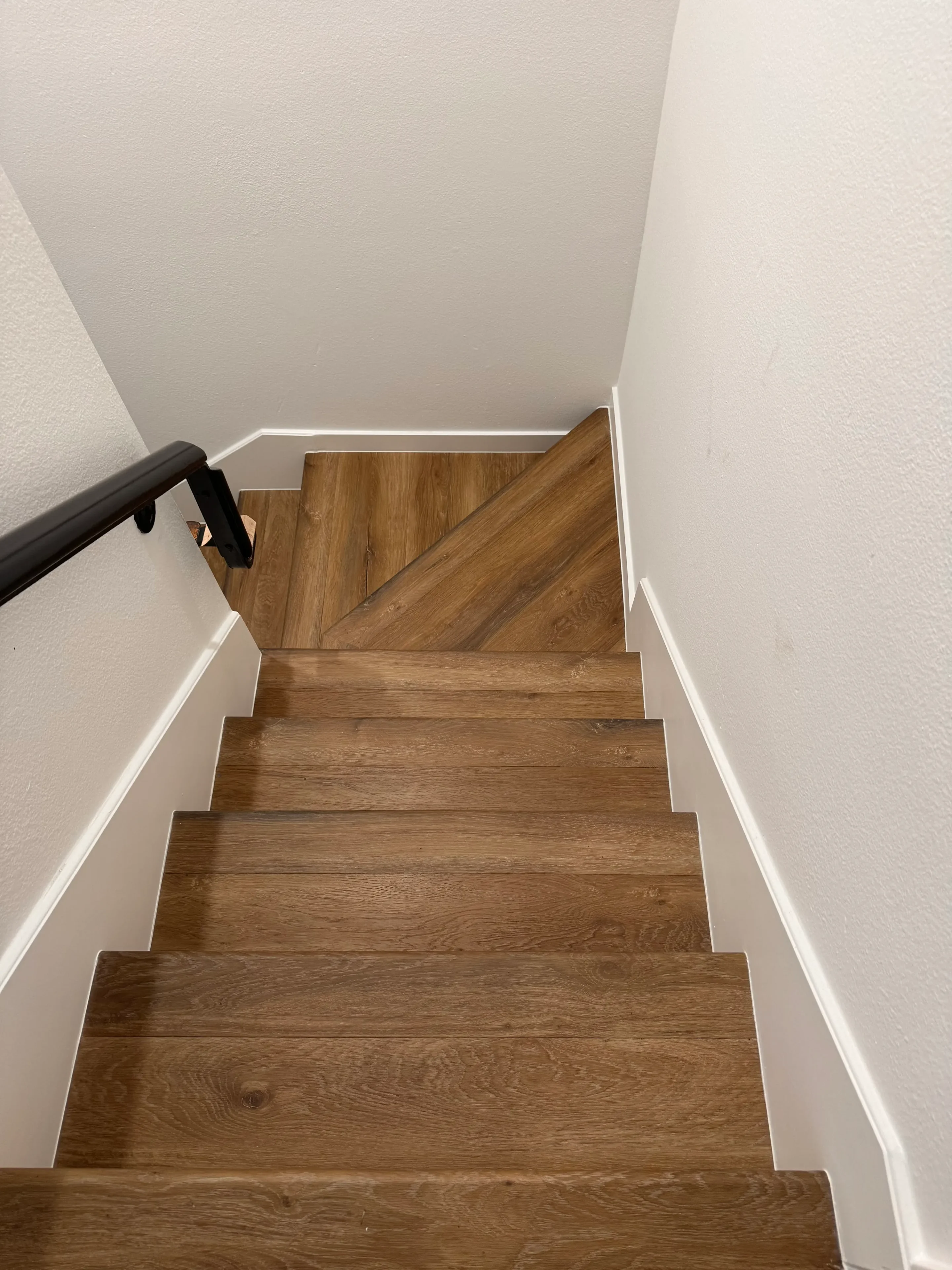 Narrow staircase with wooden steps