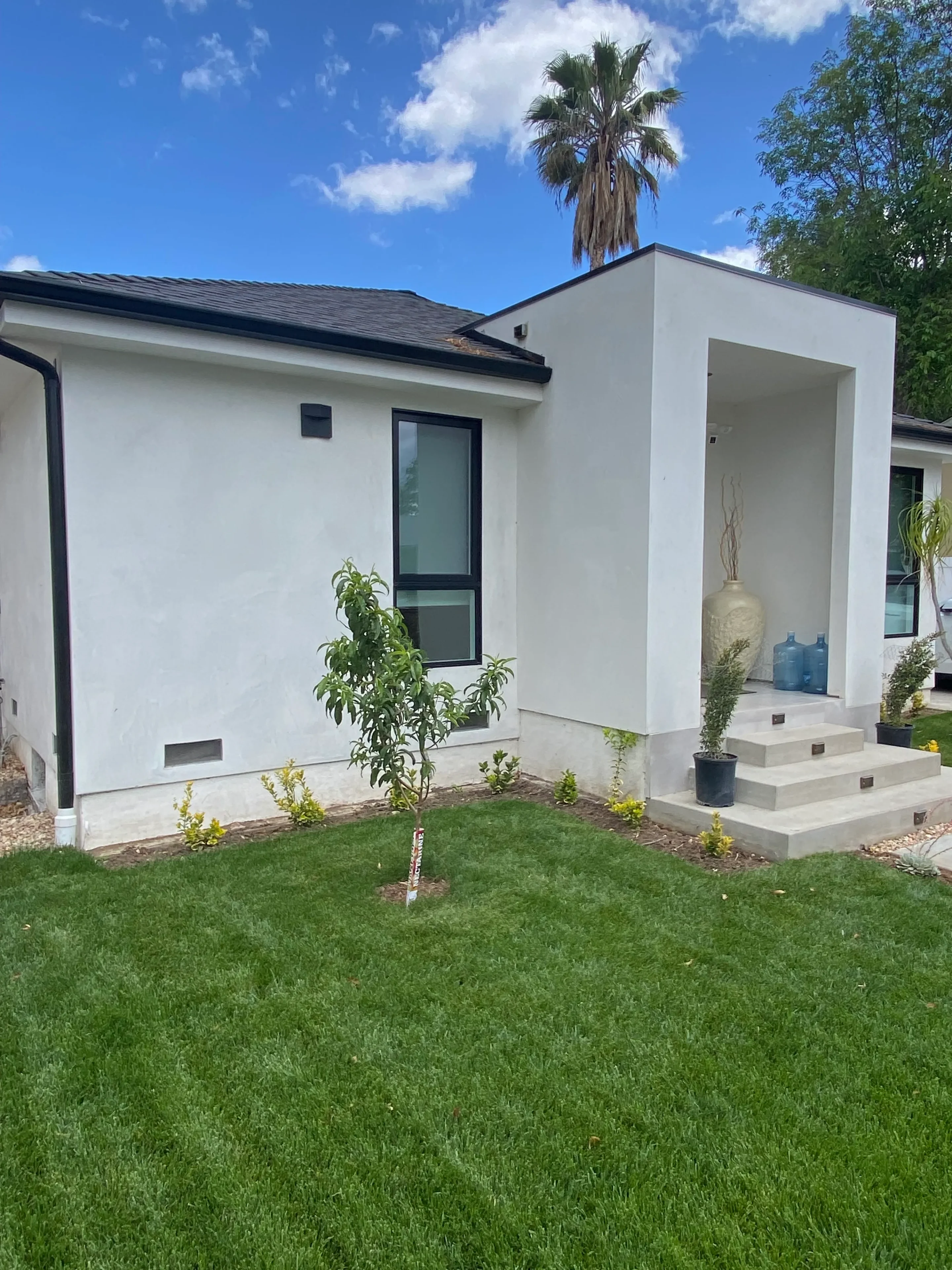 Contemporary home with lush green lawn